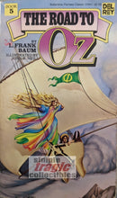 Load image into Gallery viewer, The Road To Oz by L. Frank Baum Paperback Cover Art
